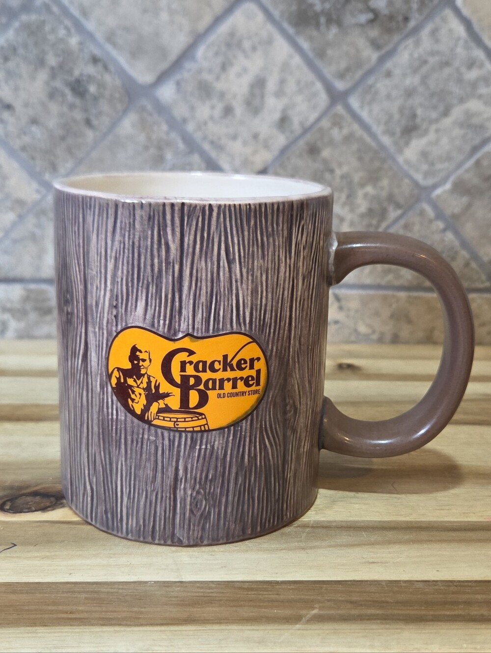 The Cracker Barrel Barnwood Logo Mug is a rustic, large round stoneware ceramic